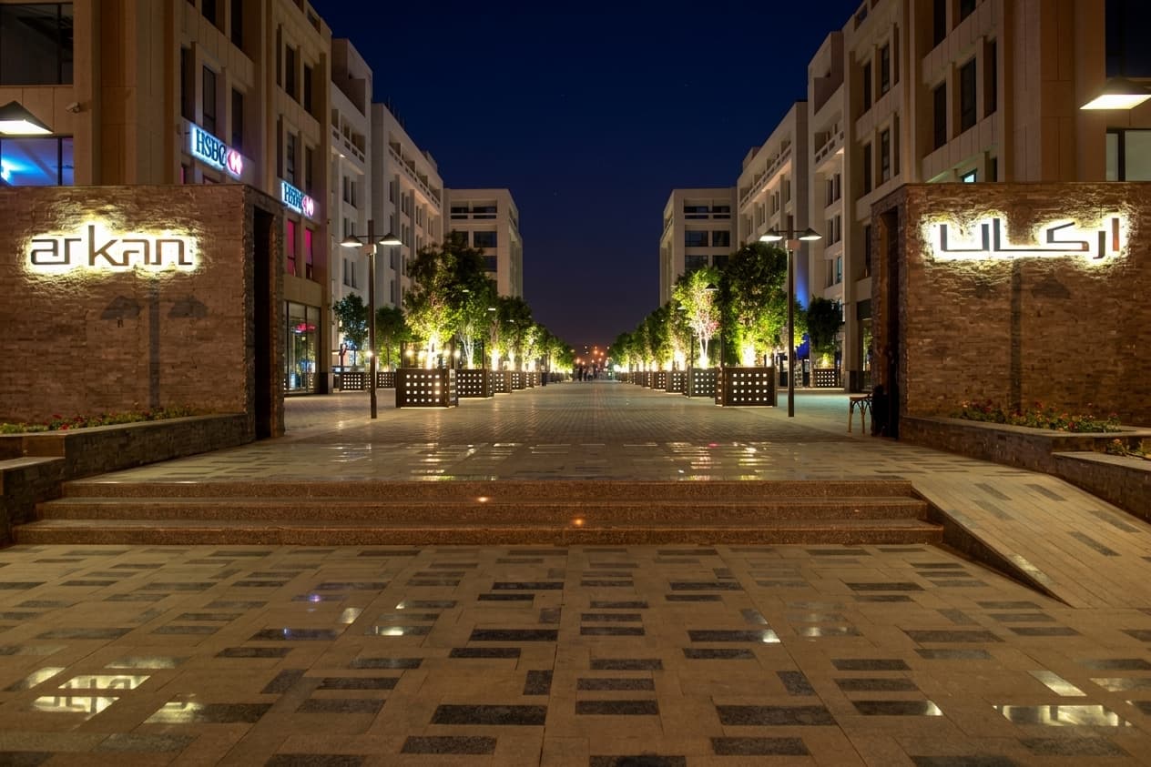 Arkan Plaza's lit promenade at night, ACTS' headquarters complex in Sheikh Zayed City