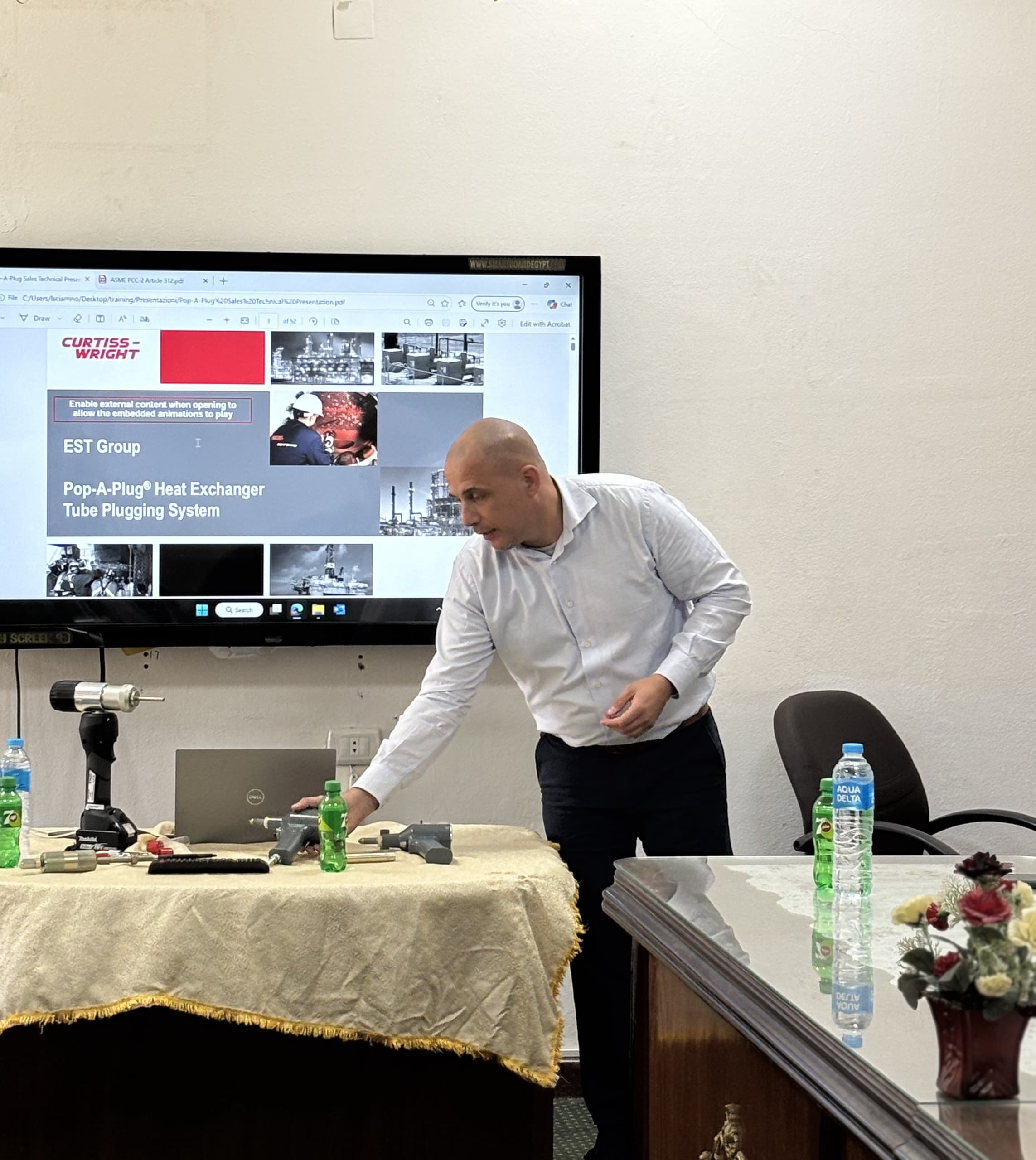 An EST Group engineer setting up the Pop-A-Plug tube plugging demonstration