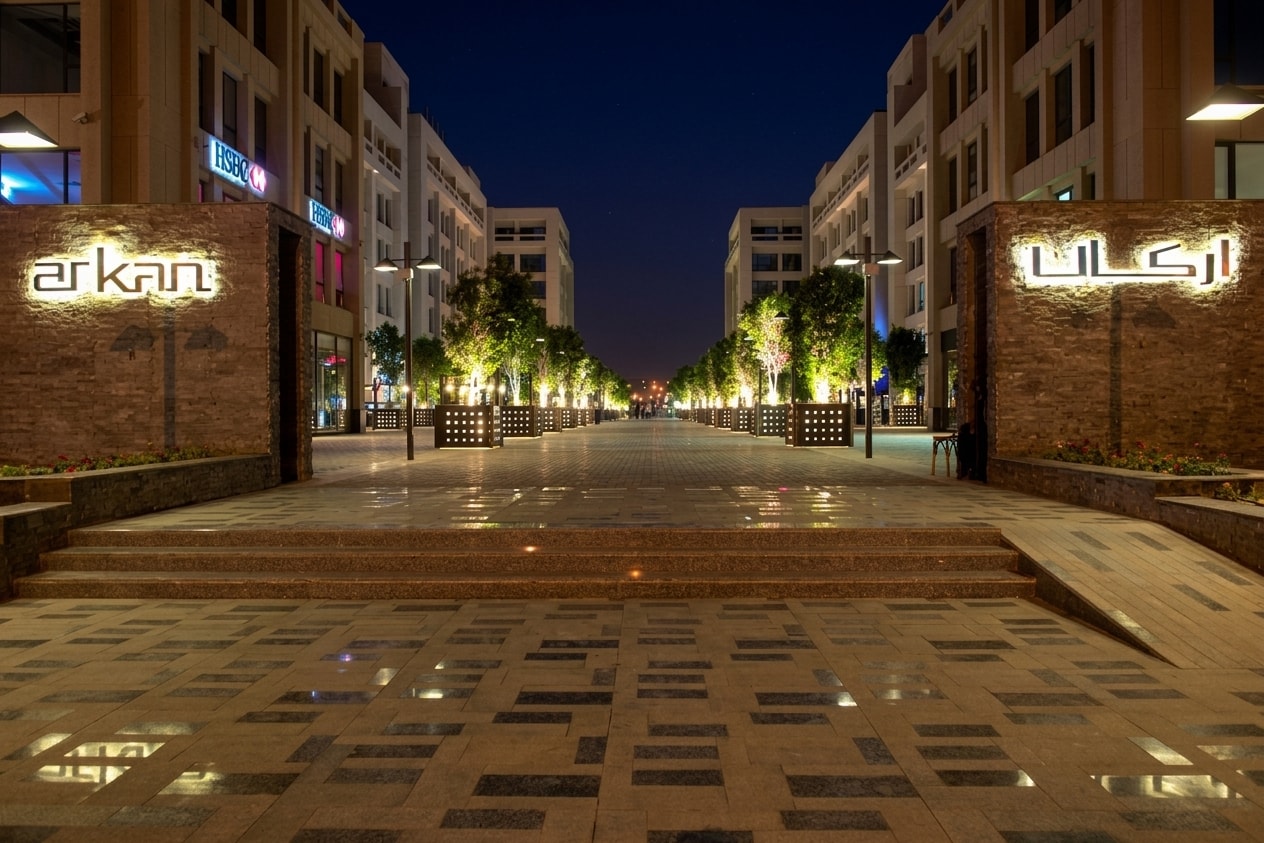 Arkan Plaza's lit promenade at night, ACTS' headquarters complex in Sheikh Zayed City